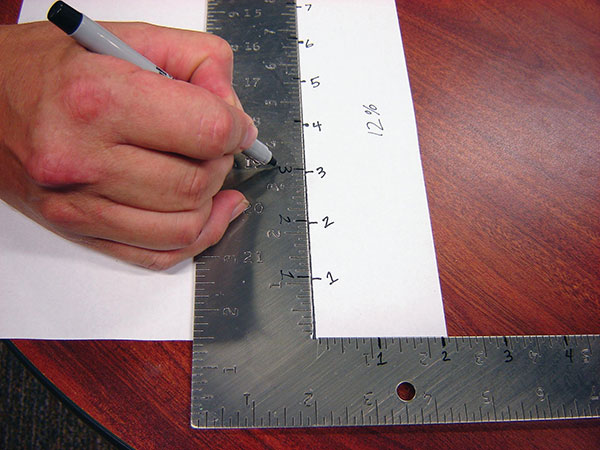 3 Enlarge a drawn ruler by 12% on a copy machine, then copy it onto a metal ruler.