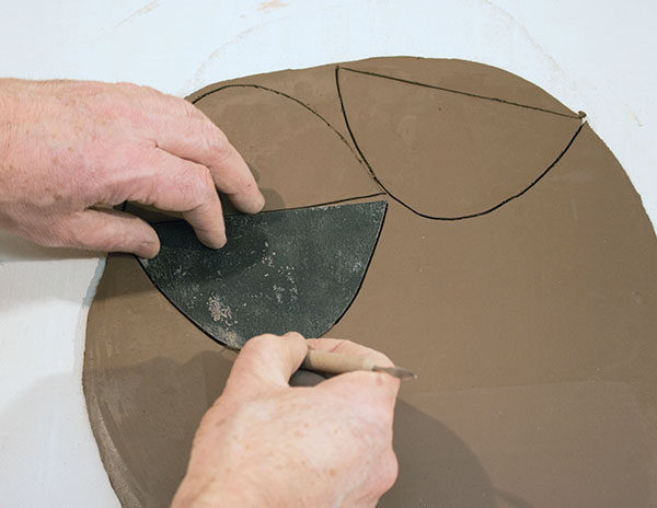 4 Use tarpaper to create templates, then cut out petal-shaped spouts.