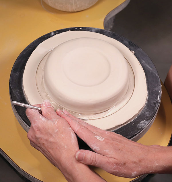 6 Cut the plate diameter ½ inch wider than the dome. Remove the excess clay. 