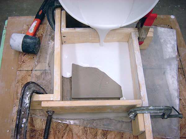 7 Mix plaster, then pour to the side of the tile, so it flows over the tile.