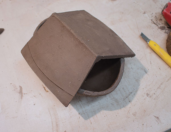 9 Slip and score the bowl rim and underside of the roof then attach the two parts. Trim the edges.