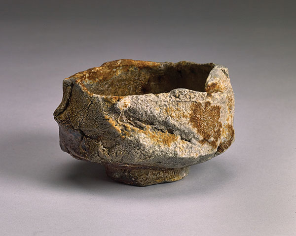 5 Stone face teabowl, 4¾ in. (12 cm) in width, handbuilt stoneware, natural-ash glaze, anagama fired for 7 days to cone 11, 2019.