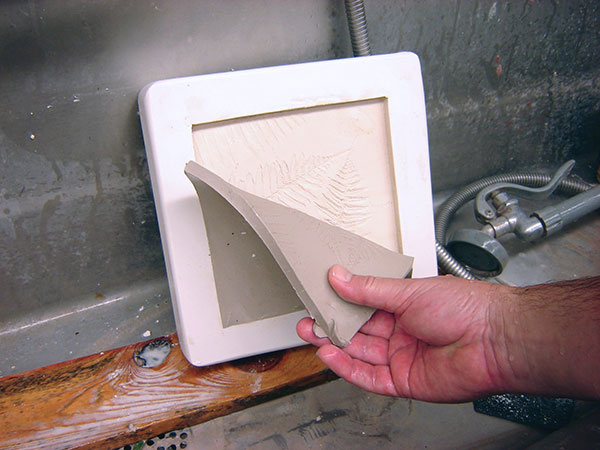 11 Remove the tile from the cast mold and discard the clay.