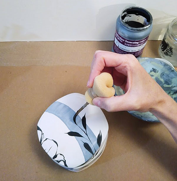 11 Apply brushwork with black underglaze using a pinstriping brush.