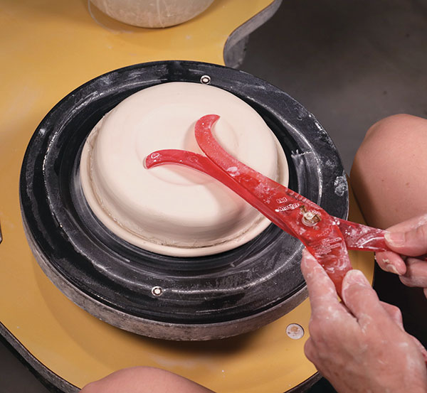 9 Use calipers to measure the width of the cup ring on top of the mold. Save the measurement to use later. 