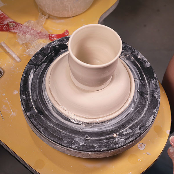 11 Drape plastic over the dome to prevent sticking and place the cup into the ring.