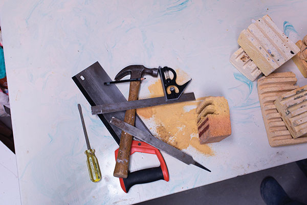 1 Tools for making the soft-brick stands: combination square, pencil, old saw, hammer, flat-head screwdriver, and file. 