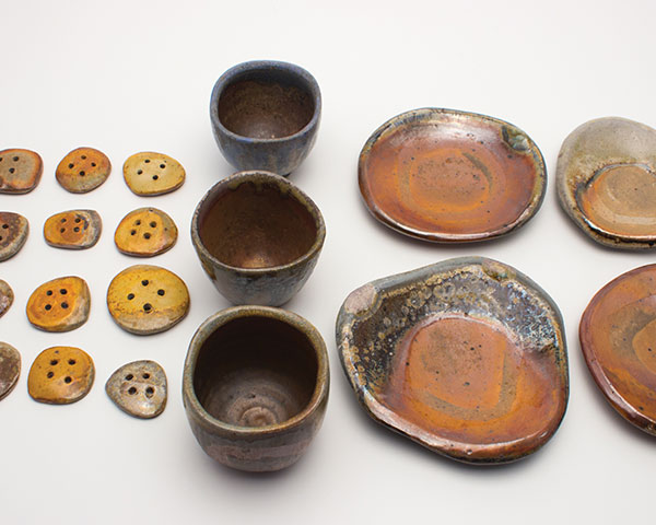 4 Buttons, shot glasses, and little dishes (tiny objects) with glaze or slip patterns, fired to cone 10.
