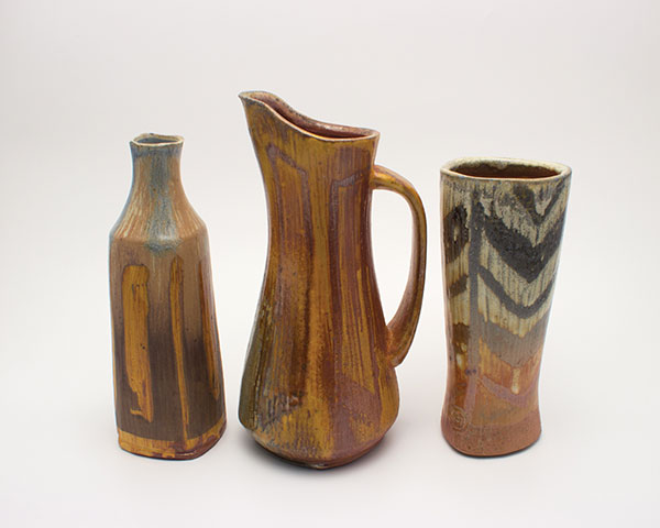 6 Bottle, pitcher, and tumbler (tall and thin objects) with glaze or slip patterns, fired to cone 10.