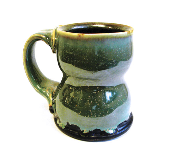 1 A mug thrown with Standard 213 clay body, glazed with 6% titanium dioxide added to the base Microcrystalline Glaze recipe and fired to cone 6.