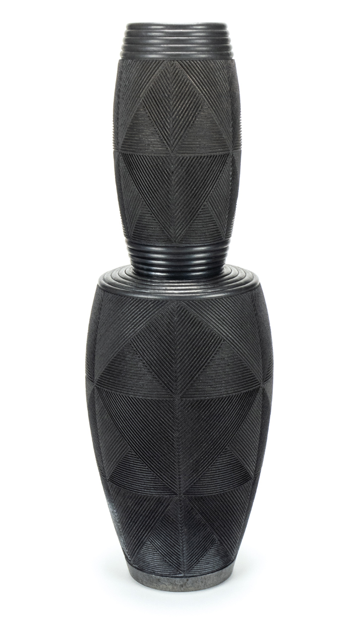 1 Andy Bissonnette’s two-tiered vase, 22 in. (56 cm) in height, carved and burnished stoneware, terra sigillata, fired to cone 06, reduced in sawdust, 2019.