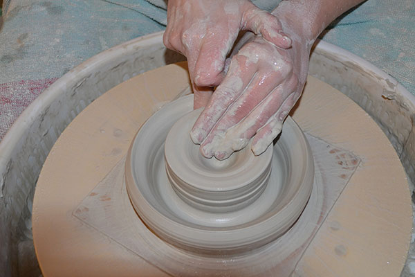 1 Start with 4 pounds of centered clay, then pull up and form a double wall.