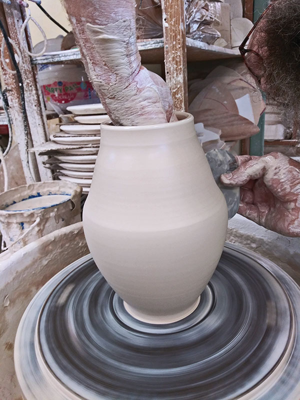 8 The form is similar to two bowls stacked rim to rim. Form the bottom bowl first.