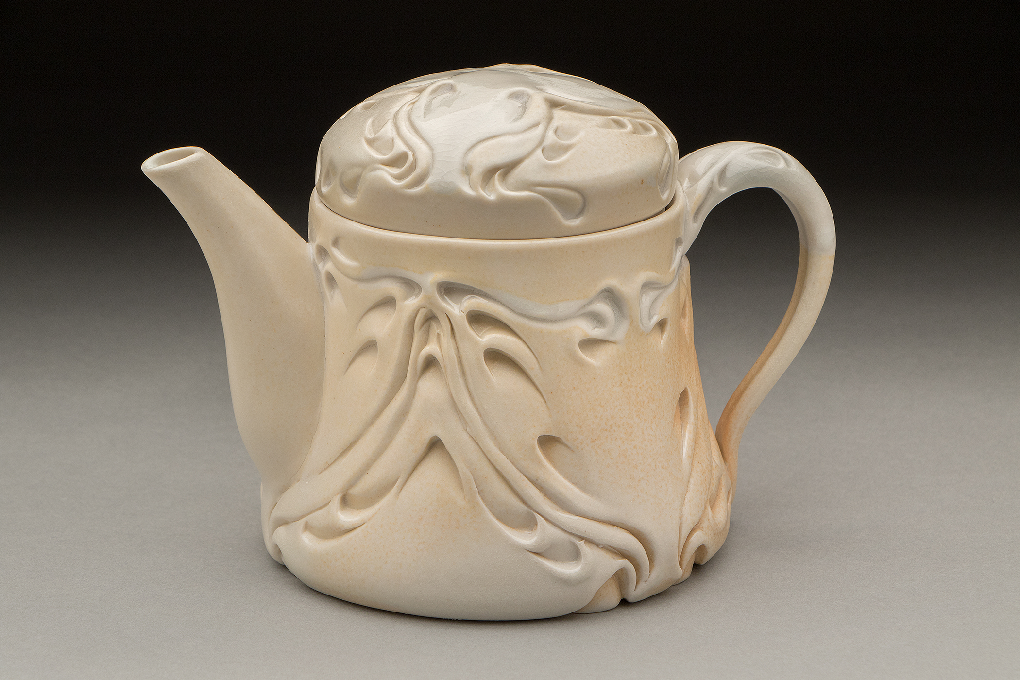 Lora Rust, Ivory Nouveau Teapot, 7 in. (18 cm) in height, porcelain, soda fired to cone 7