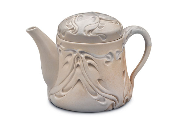 13 Lora Rust’s Ivory Nouveau Teapot, 7 in. (18 cm) in height, porcelain, soda fired to cone 7, 2018. 