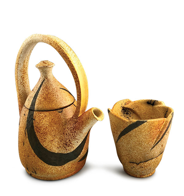 6 Swanica Ligtenberg’s horsehair raku teapot set, 11 1/2 in. (29 cm) in height, high-fire white clay, black clay, mishima, bisque fired to cone 04, sugar, ferric chloride, raku fired to 1150°F. (621°C), horsehair, food-safe lacquer. 