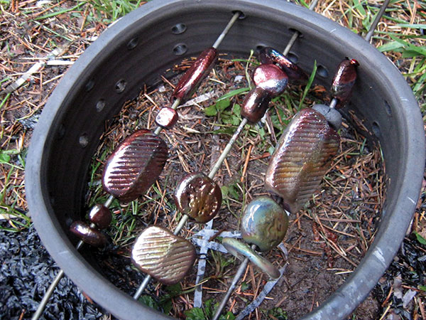 4 Finished raku beads and rack after being removed from the reduction can. 