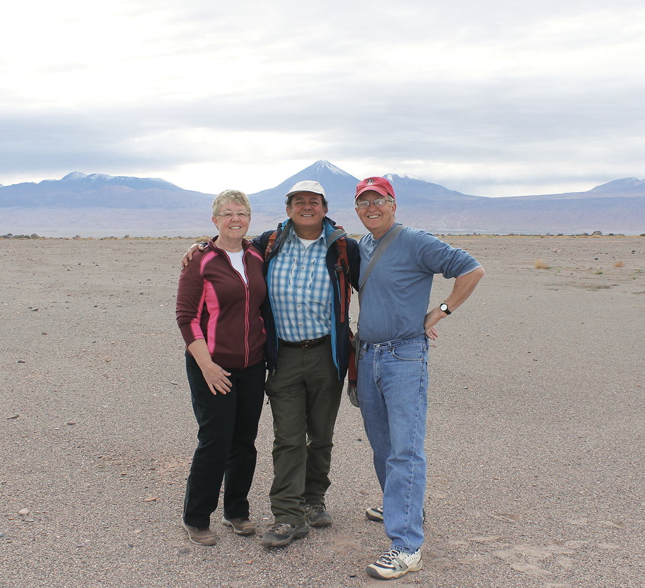 1 Carol, Luis Aracena, and Craig at a Pre-Columbian site near San Pedro de Atacama with the Andes Mountains in the background, 2017. 