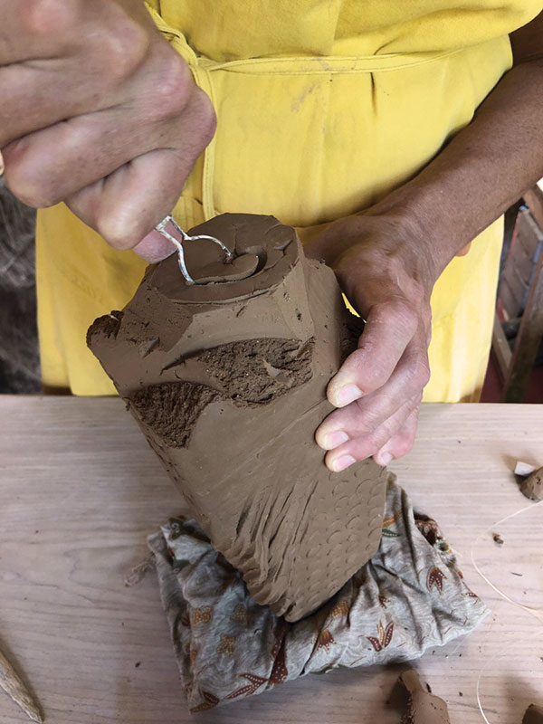 10 Carve a foot into the bottom of the form with a loop tool and refine.