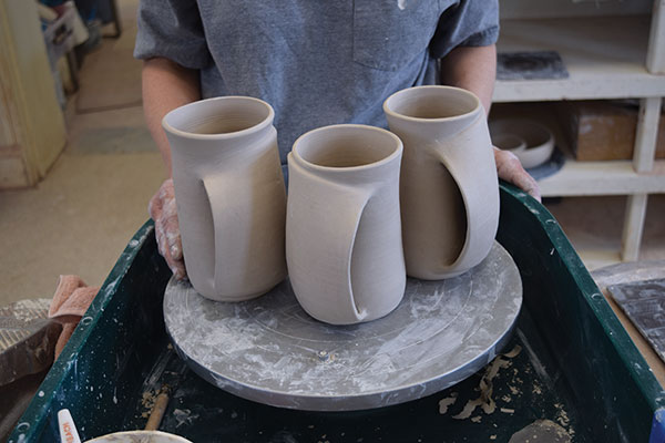 10 Add a pinch of clay to the corners of the pocket where it joins the mug to keep the pieces from pulling apart as the mug dries.