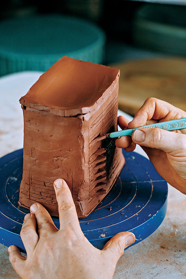 3 As you begin to cut, make sure the clay is firm enough and will not distort under the pressure of a knife.