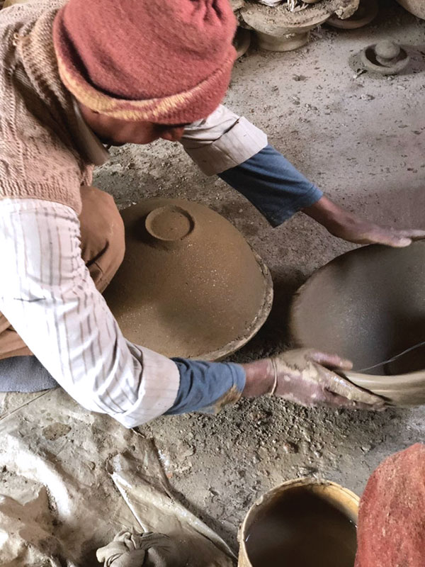 9 Removing the bottom half of the press mold to reveal the foot.