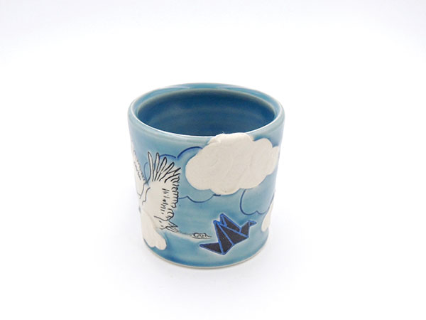 Origami Crane Mug, 4 in. (10 cm) in height, porcelain, mishima, underglaze, paper stencils, sgraffito, glaze, fired to cone 6 in oxidation, 2019.