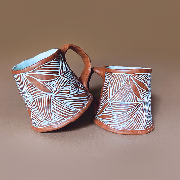 7 Pair of pinched mugs, 4½ in. (11 cm) in height, mid-range red stoneware, glaze, fired to cone 5, 2020.