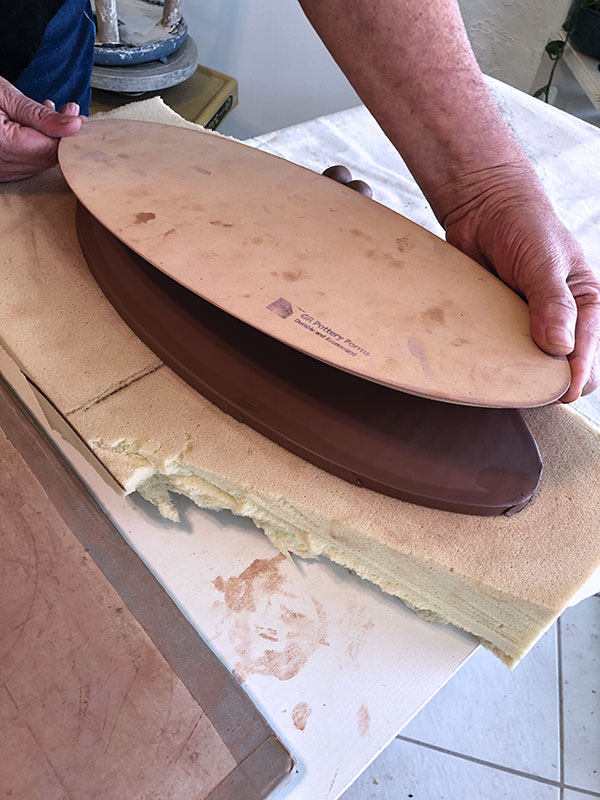 2 On foam, center the form over the slab and press down several times.