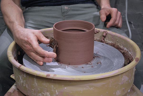 6 Use a rasp to trim, expose grog, and add texture to the centered canister.