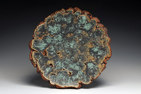 1 Ginny Marsh’s Solitaire, 18 in. (46 cm) in diameter, coarse stoneware, engobe, glazes, gas fired to cone 10 in reduction.