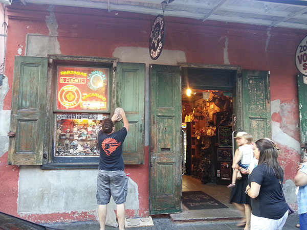 2 Making molds of peeling paint on the shutters of Rev. Zombie’s Voodoo Shop in the French Quarter.