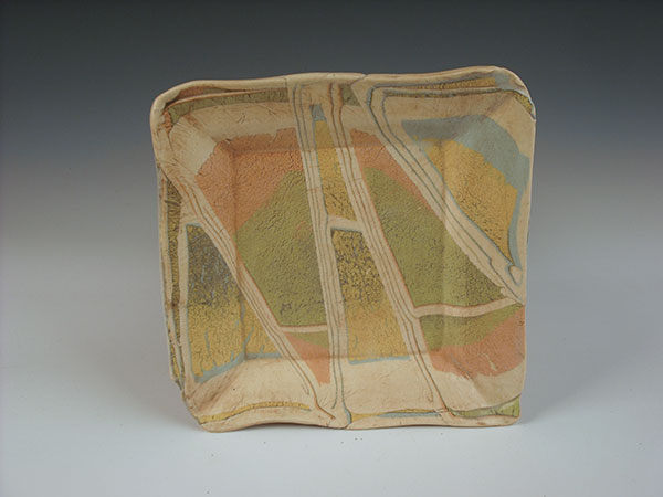 3 Allan Kluber’s plate, horizontally layered colored clays.