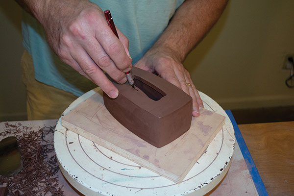 6 Use a sharp knife to cut into the center of the top slab, opening the containing space.