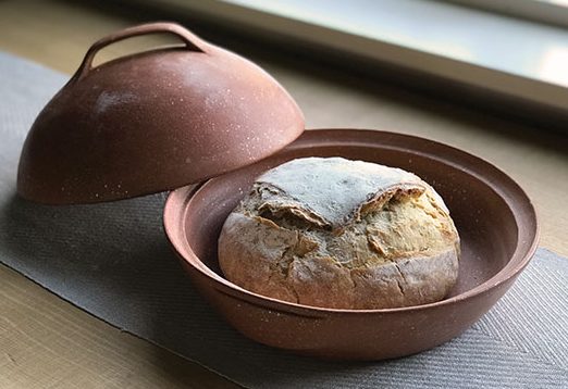 baking bread in a ceramic bowl