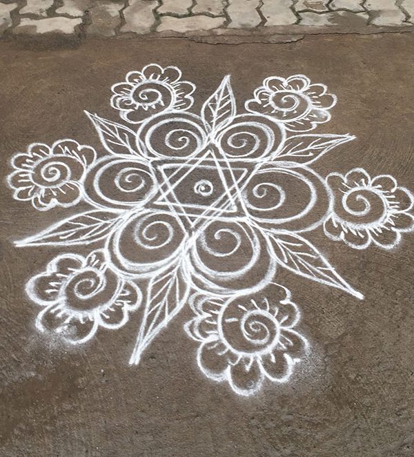 1 A kolam drawn on the ground outside of a home in Puducherry, India.