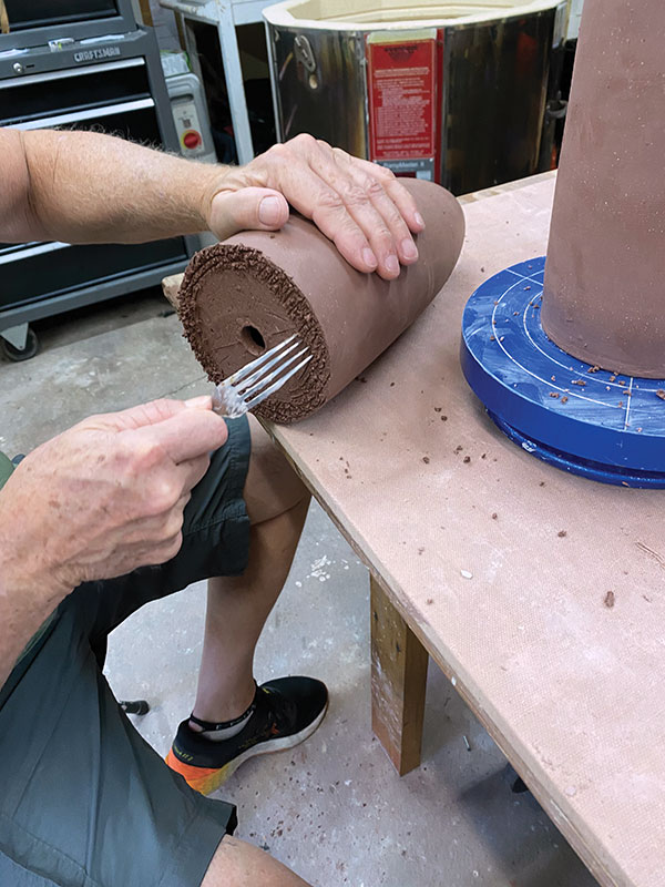 7 Score the attachment areas, add slip, and join the two cylinders together, with the bowl-shaped opening as the top.