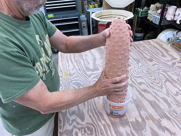 15 Measure out glaze into a bucket and dip the tips of the pointed appendages into glaze. Fire the piece to cone 04.