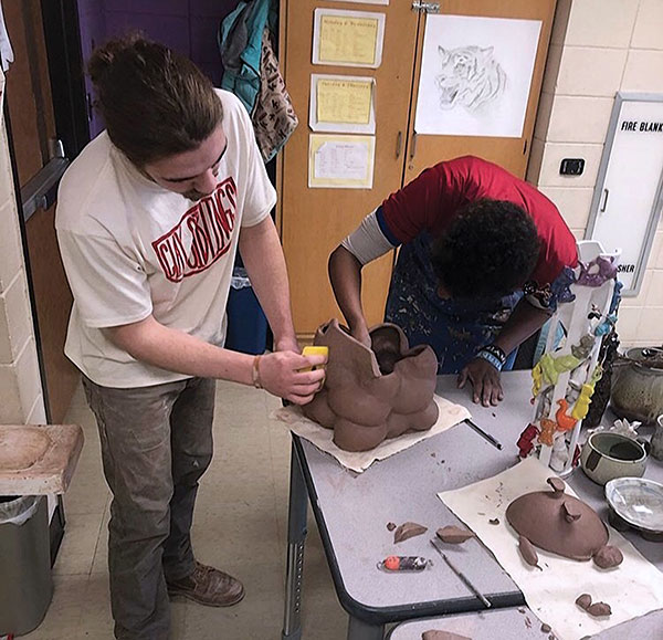 2 2019 Clay Sibling Austin Coudriet and a student building a sculpture on the first day of a workshop at Wellstone International High School, Minneapolis, Minnesota.