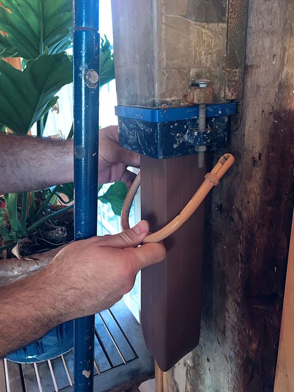 1 Use a bamboo teapot handle with a piece of fishing line or wire tied onto it to cut the tube off the extruder.