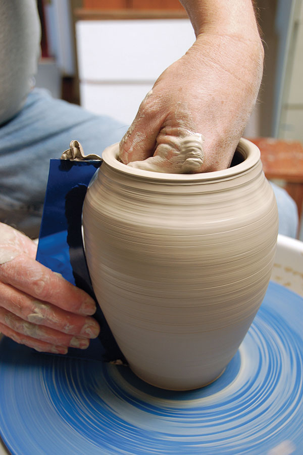 6 Moving from the top to the bottom, make certain the entire pot conforms to the template.