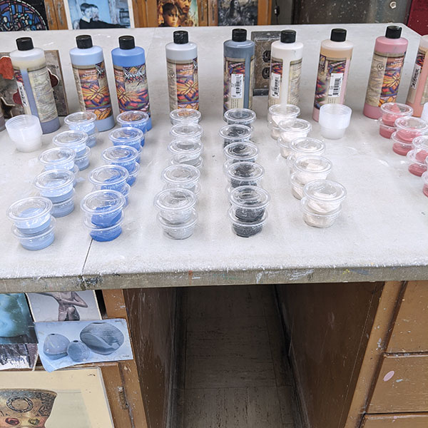 1 Underglazes being prepped in condiment containers for Kelly Clark’s students to take them home to decorate the surfaces of their projects.