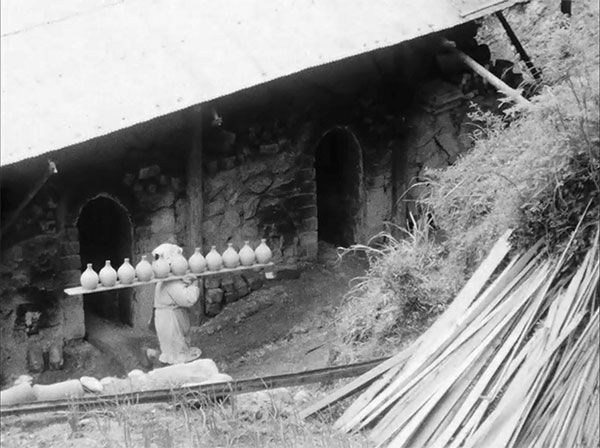 1 Carrying sake bottles to a climbing kiln from The Village Potters of Onda, by Robert Sperry, 1963.