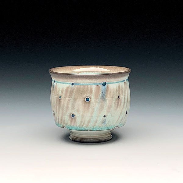 5 Andrew McIntyre’s perforated cup, 3½ in. (9 cm) in height, wheel-thrown porcelain, celadon glaze, soda fired to cone 11, 2020.