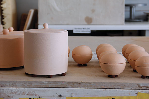 13 Bisque-fired pots ready for the kiln.