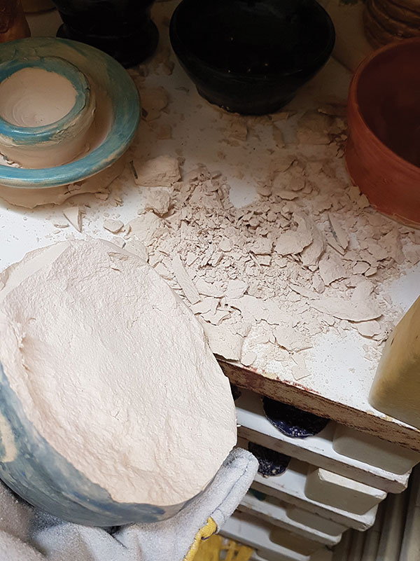 A The aftermath of a clay explosion in a bisque firing due to firing wet pots.