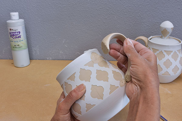 8 Score and slip the area where you removed glaze, then attach the handle.