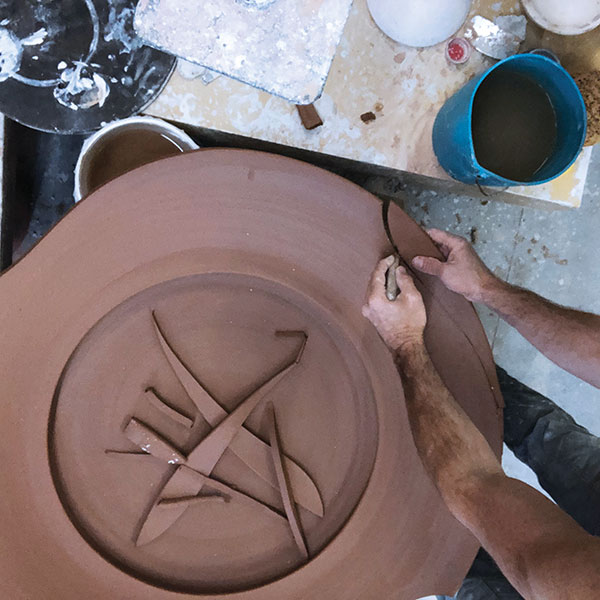 11 Alter the rim of the platter when it is still soft leather hard so that small adjustments and curves can be made along the form.