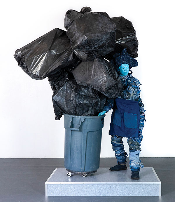 2 Service: Trash, 8 ft. 7 in. (2.6 m) in height, earthenware, fired to cone 1 in oxidation, secondhand fiber, readymade objects, metal, wood, 2019.