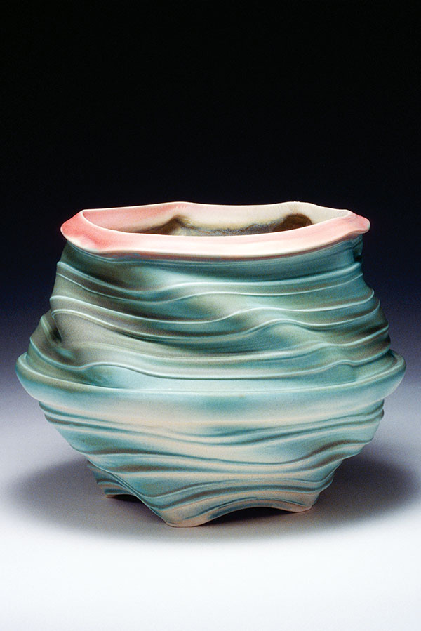 Bowl, Dancing Series #2, 9 in. (23 cm) in diameter, thrown, altered, and assembled porcelain, satin antique green glaze, satin antique pink glaze, fired in an electric kiln to cone 6.